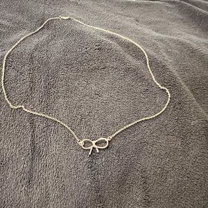 Delicate gold bow necklace